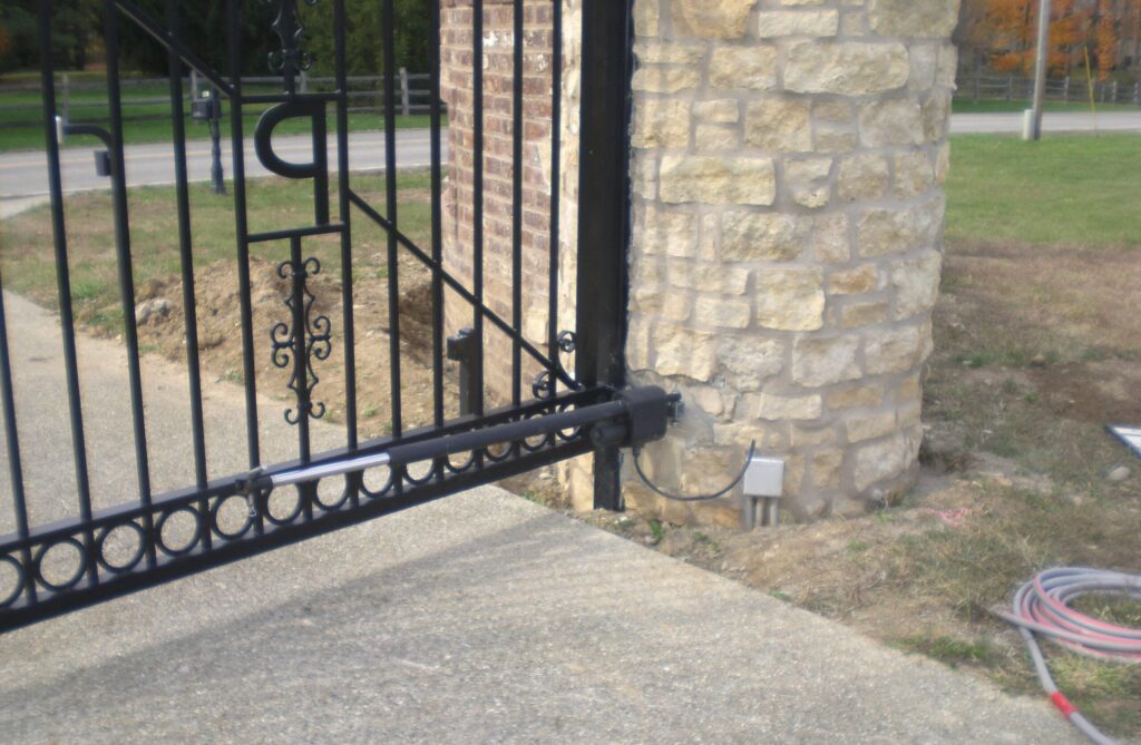 Close-up of automatic gate operator and control system for driveway