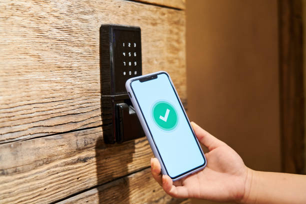 A person using their smartphone to unlock a Bluetooth-enabled lock