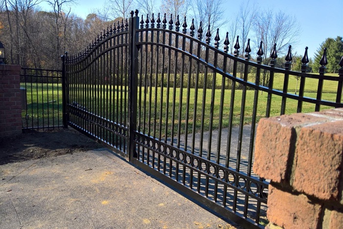 Large decorative gate with underground opener mechanism