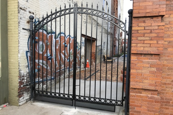 Ornate gate with robust mounting and entry system