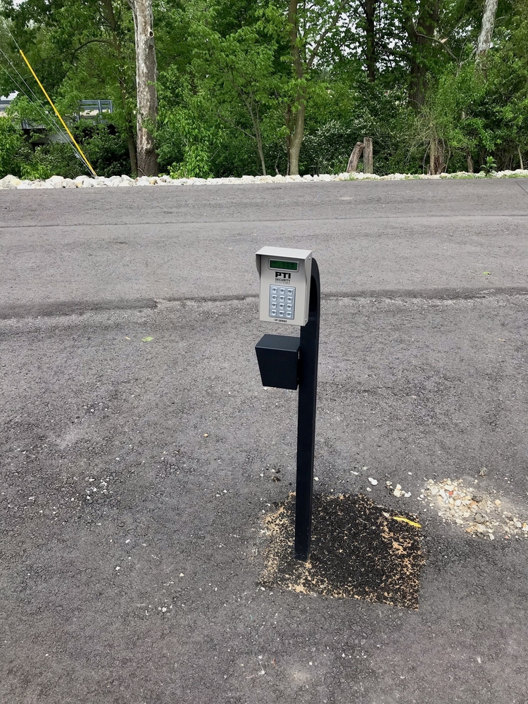 Close-up of a newly installed automatic gate keypad entry system