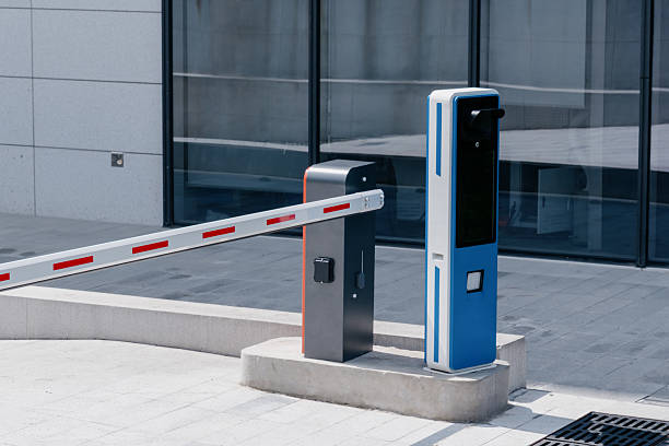 Automatic barrier arm gate system at modern building entrance