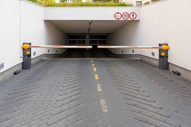 Automatic barrier arms at underground parking garage entrance